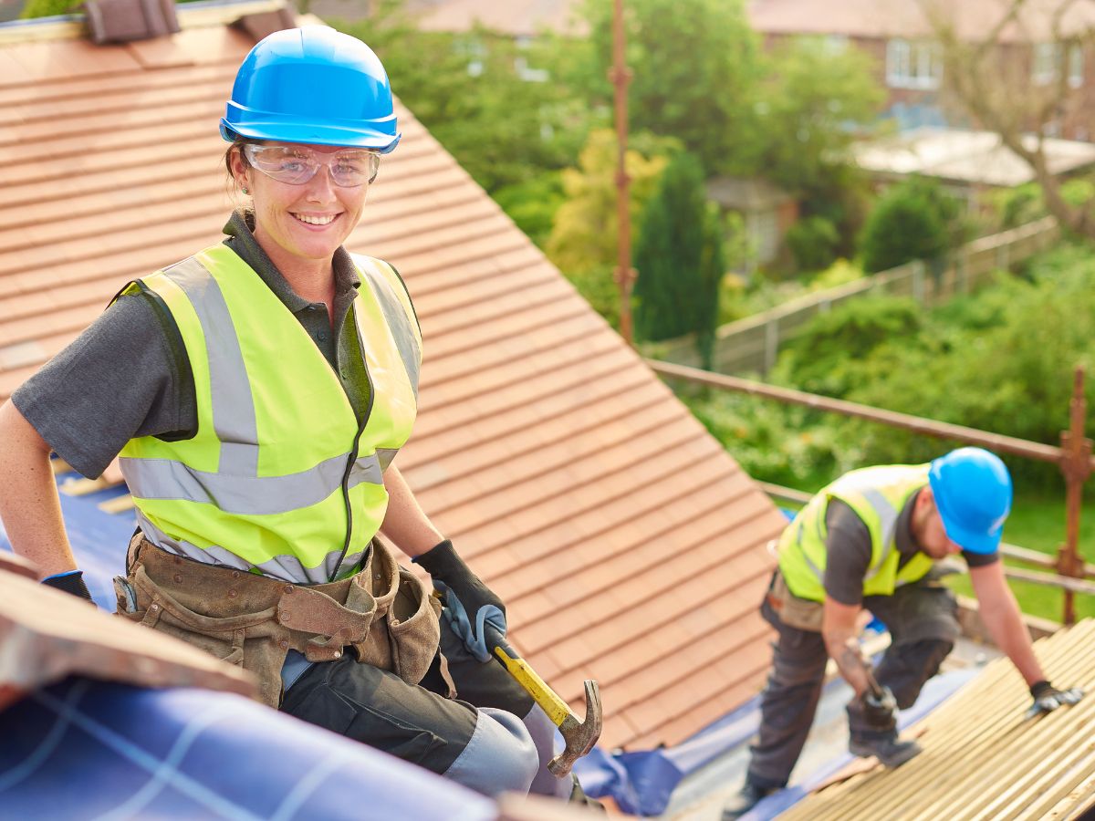 Contractors working on roof replacement project