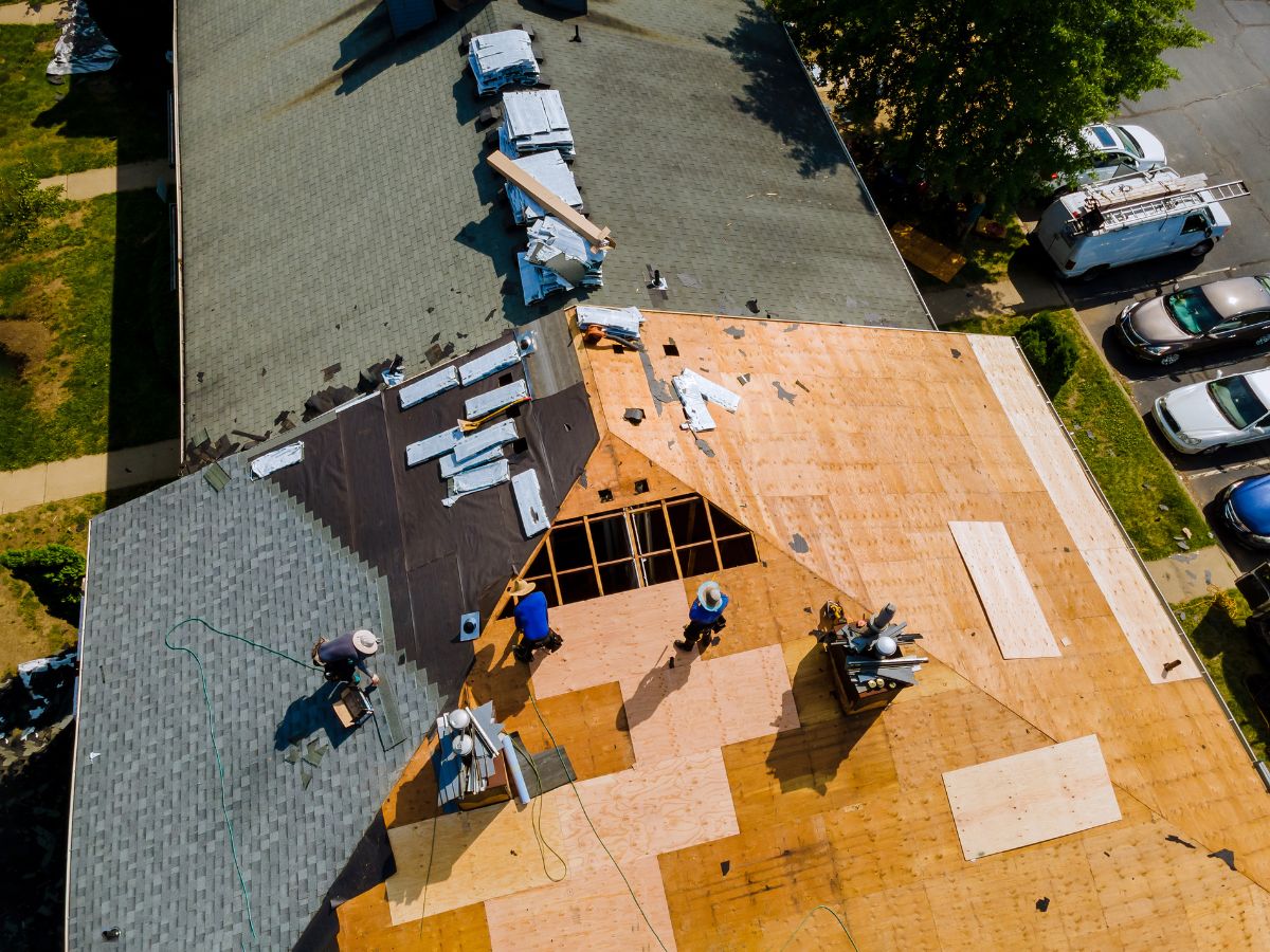 Roofers doing a roof replacement on a residential home